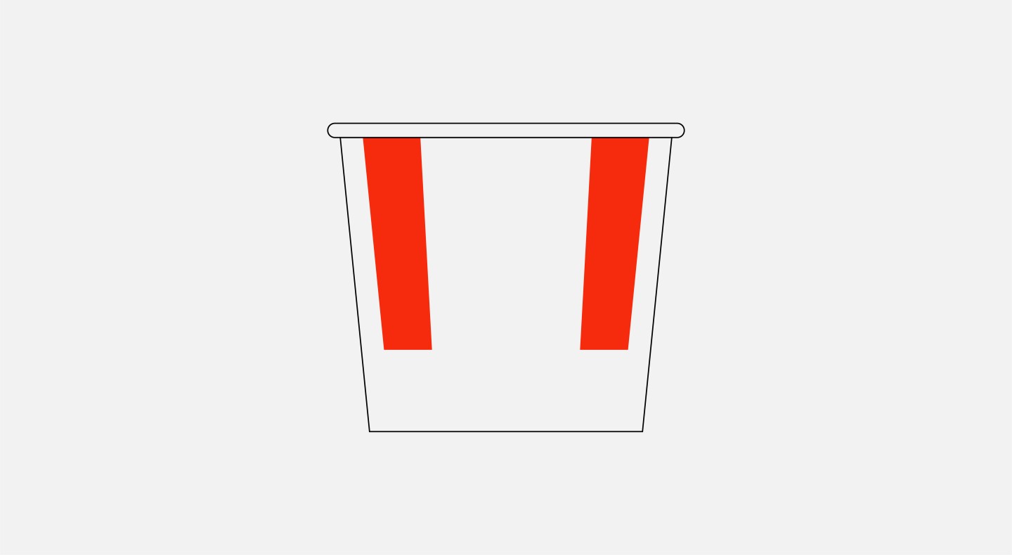 Graphic illustration of large cardboard food bucket with red stripes, representative of a famous global fast food retailer.