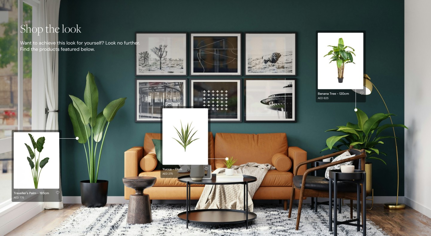 Image of living area with brown leather sofa and artificial plants
